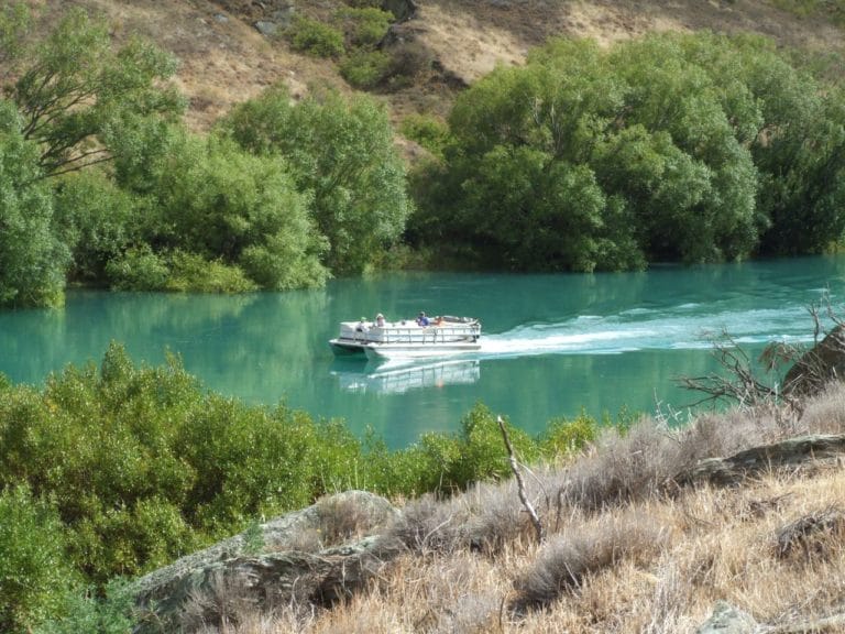 Boat going up the Clutha River to Doctors Point.