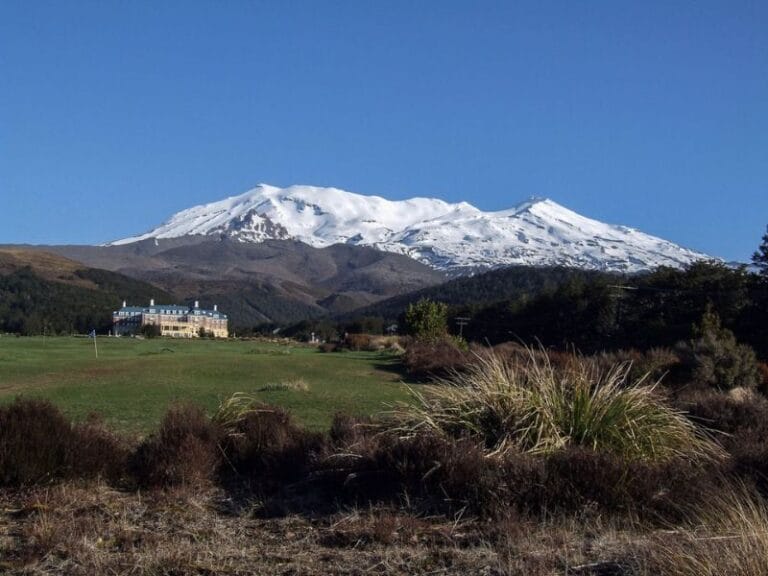 Stunning view of the Chateau with snow-capped mountains in the background